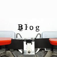 Typewriter with piece of paper that says, 